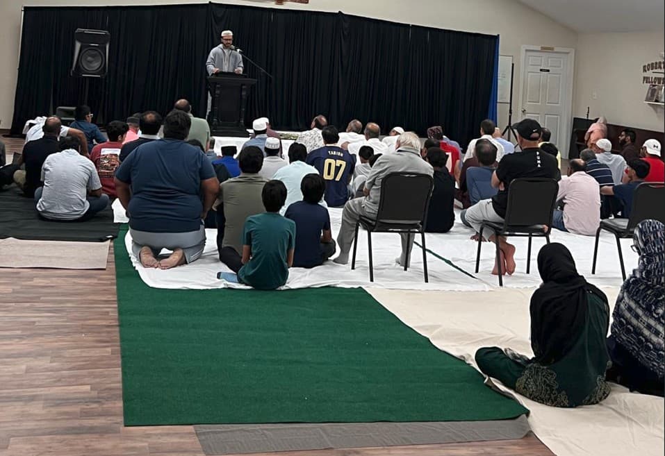 Congregation listening to the Friday khutbah at Ballantyne Islamic Center’s interim venue